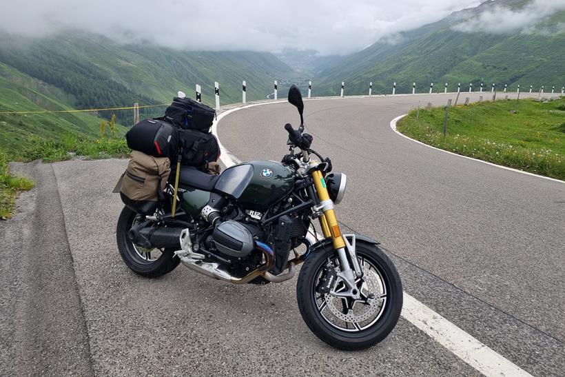 BMW R12 nineT parked by a bend