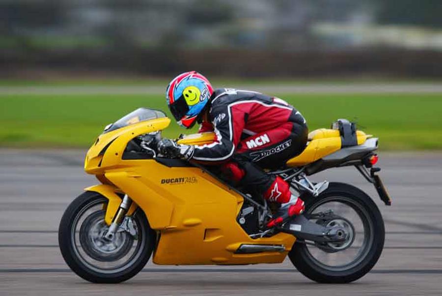 Hunkered down on the tank of the Ducati 749 during speed testing