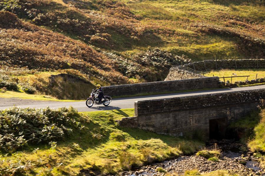 2025-on Royal Enfield Classic 650 crossing over a country bridge