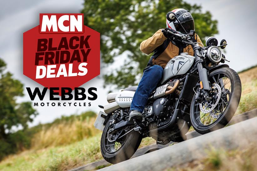 A Triumph Scrambler being ridden by Ben Clarke, with MCN's Black Friday Deals logo