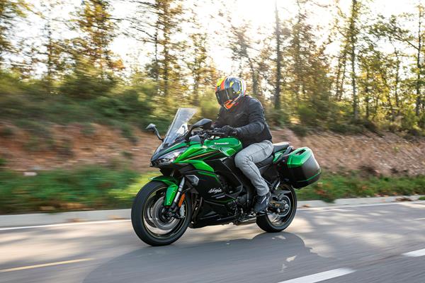 2025-on Kawasaki Ninja 1100SX cruising down a road