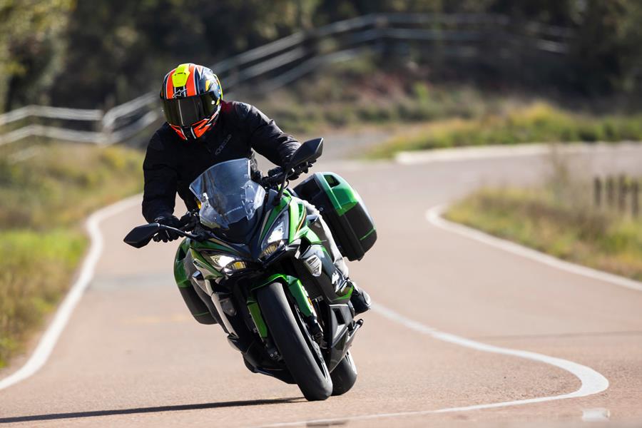 2025-on Kawasaki Ninja 1100SX SE riding down a road