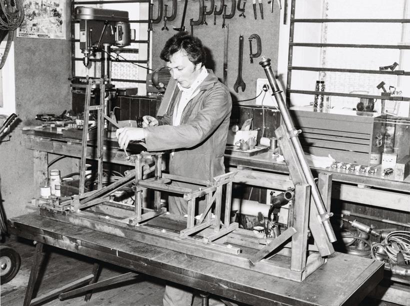 Ron Williams working on early motorcycle chassis parts