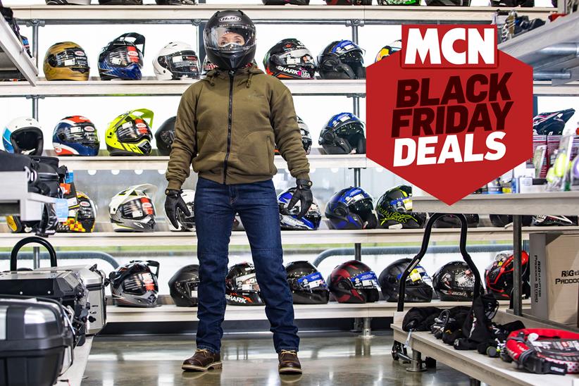 MCN Editor in a motorcycle clothing shop trying on kit