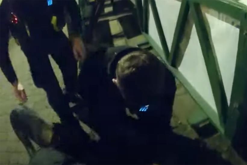 Thief on the ground being arrested