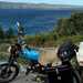 Honda SS50 parked up by the sea