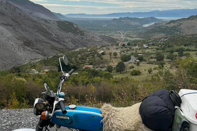 Honda SS50 overlooking mountains