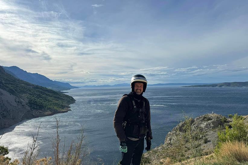 Phil Ranson poses on a coastline