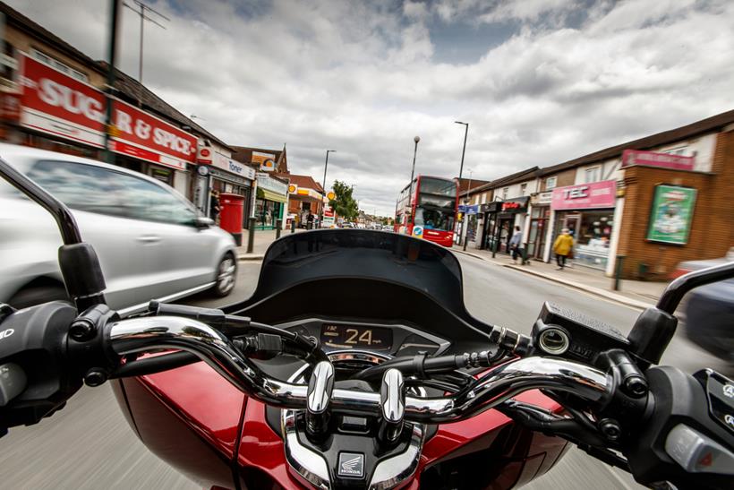 Scooter onboard view in town