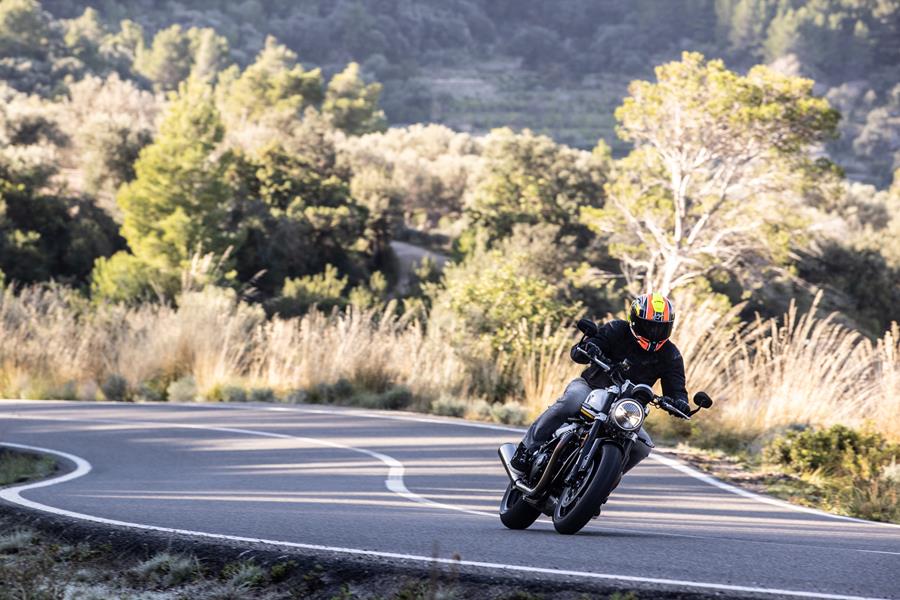 2025-on Triumph Speed Twin 1200 carving down a road