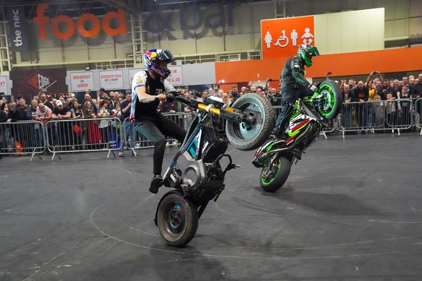 Stunt display with two riders wheelieing