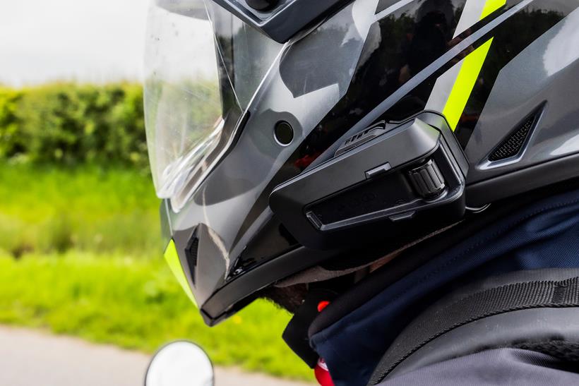 Cardo Packtalk Pro fitted to a motorcycle helmet