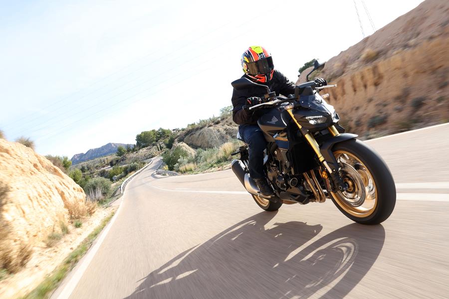 2025-on Honda CB1000 Hornet SP riding past the camera