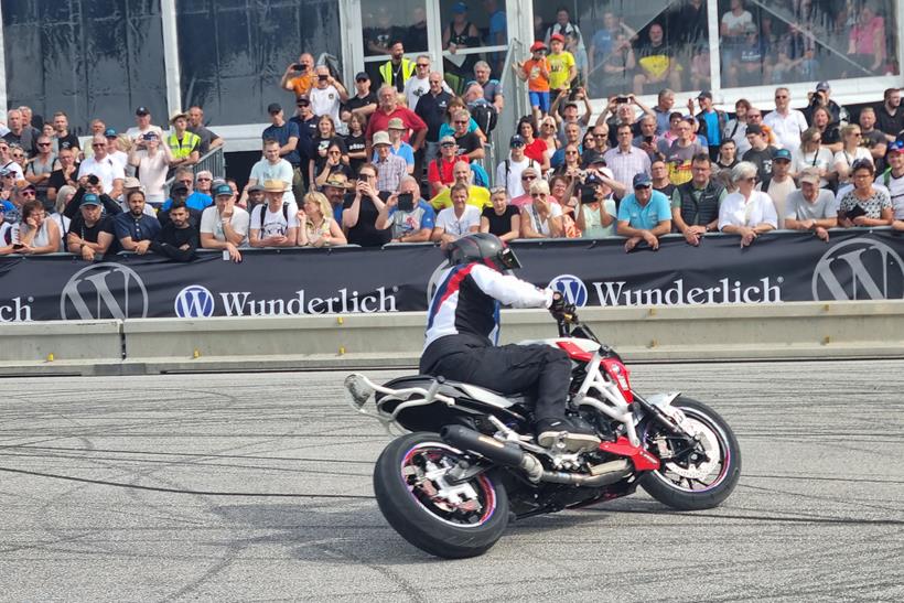 Motorcyclist performing for spectators at a BMW Motorrad Days event