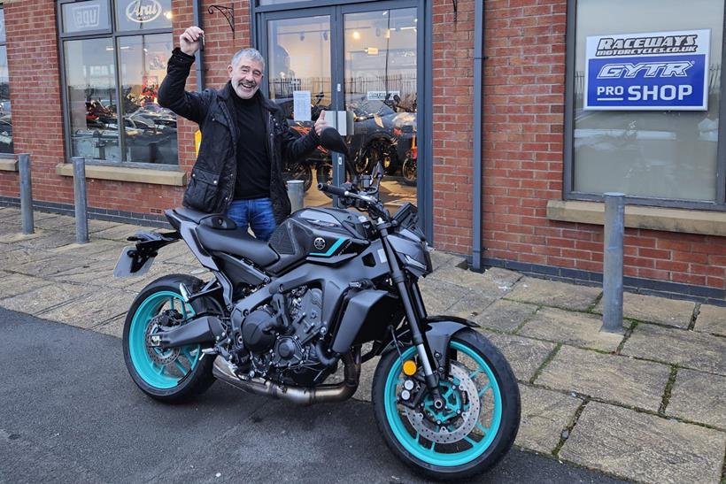 Competition winner George Stoddart celebrates with his new bike