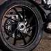 2025-on Kove 125R detailed shot of the rear wheel and single sided swing arm