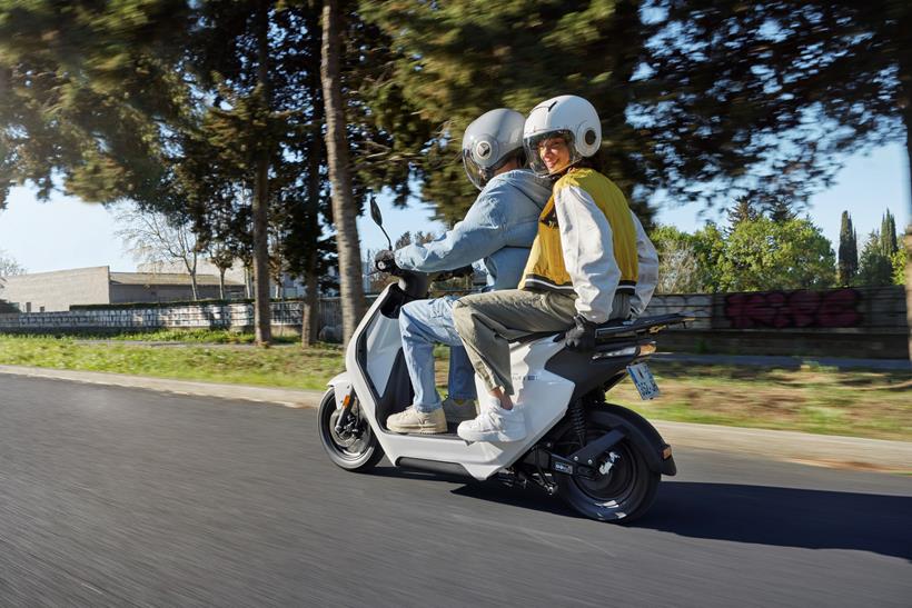 Honda EM1 e ridden with a pillion passenger