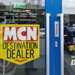 MCN destination dealer sign on door