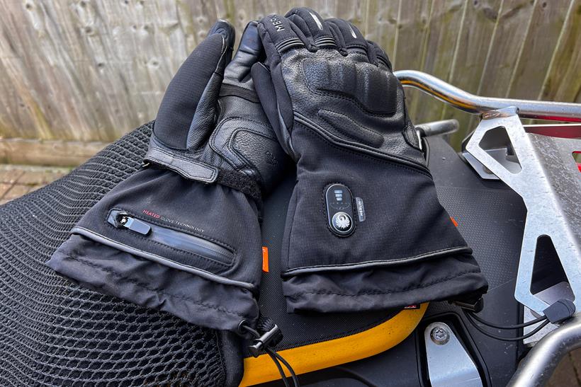 Merlin Curborough heated gloves on seat of motorcycle