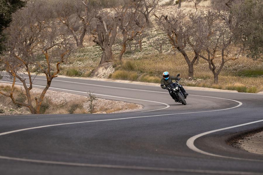 2025-on Kawasaki Z900 riding through a set of curves