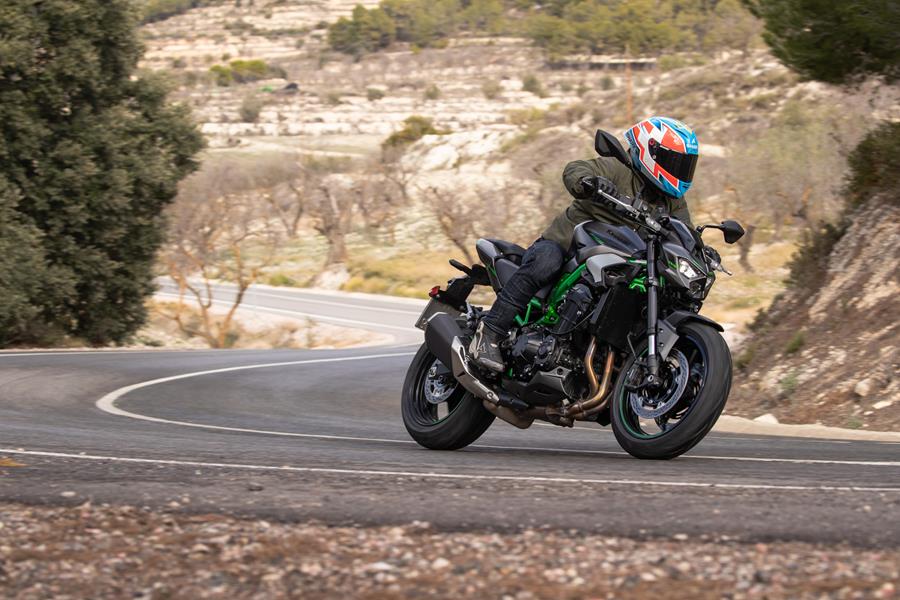 2025-on Kawasaki Z900 riding through a canyon