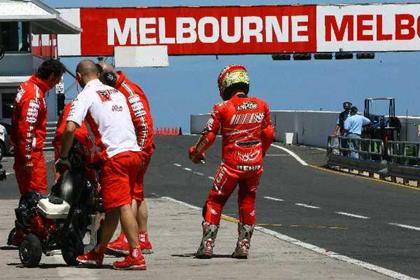 Capirossi takes a break as the geese are removed 