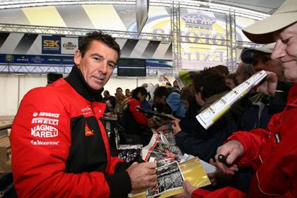 Troy Corser chats to fans before practice this morning