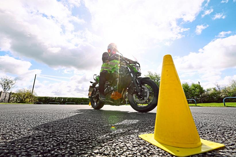 Motorcycle passes a cone during training