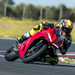 2025-on Ducati Panigale V2 S knee down on a corner