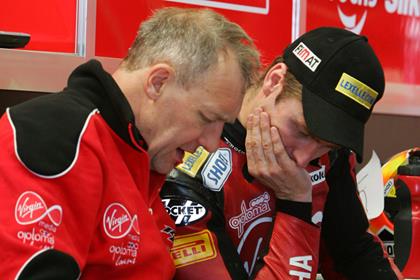 Haydon, seen here talking to his crew chief at Silverstone, is ruled out through injury