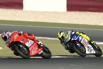 Stoner withstands the pressure from Rossi to win again