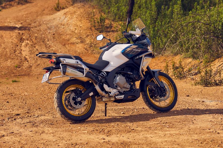 2025-on CF Moto 700MT - static shot of the right hand side of the engine parked on a gravel trail