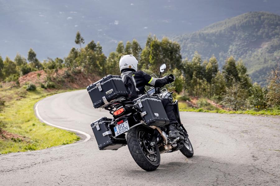 2025-on CF Moto 700MT - cornering down a mountain with full pannier set