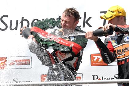 Bruce Anstey celebrates his win