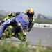 2025-on Yamaha R9 riding round a corner with the riders knee down