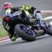 2025-on Yamaha R9 rear shot of bike leaning hard into the left hander