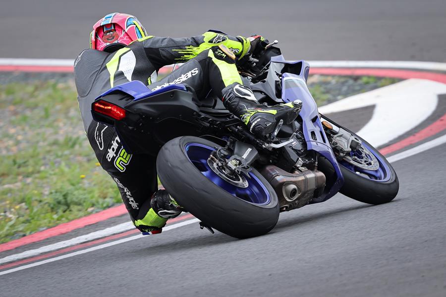 2025-on Yamaha R9 rear shot of bike leaning hard into the left hander
