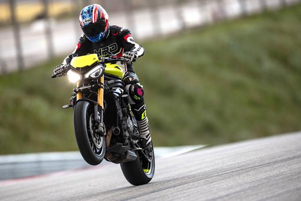 2025 Triumph Speed Triple 1200 RX, lifting the front at Portimao