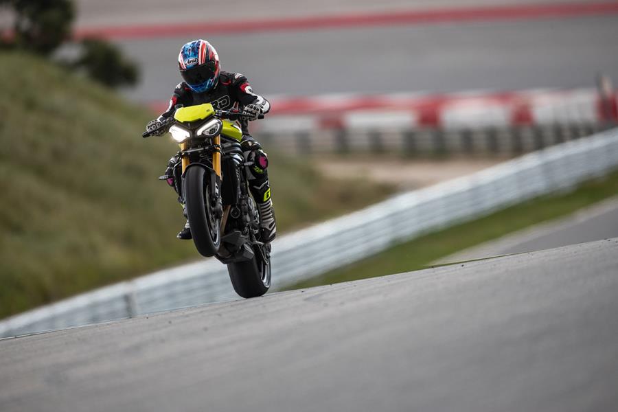 2025 Triumph Speed Triple 1200 RX, wheelie in action