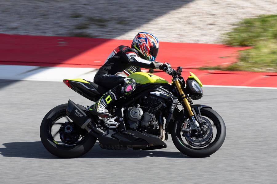 2025 Triumph Speed Triple 1200 RX, leaning into a left turn