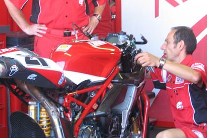 Troy Bayliss' motorcycle is worked on in the Xerox Ducati garage