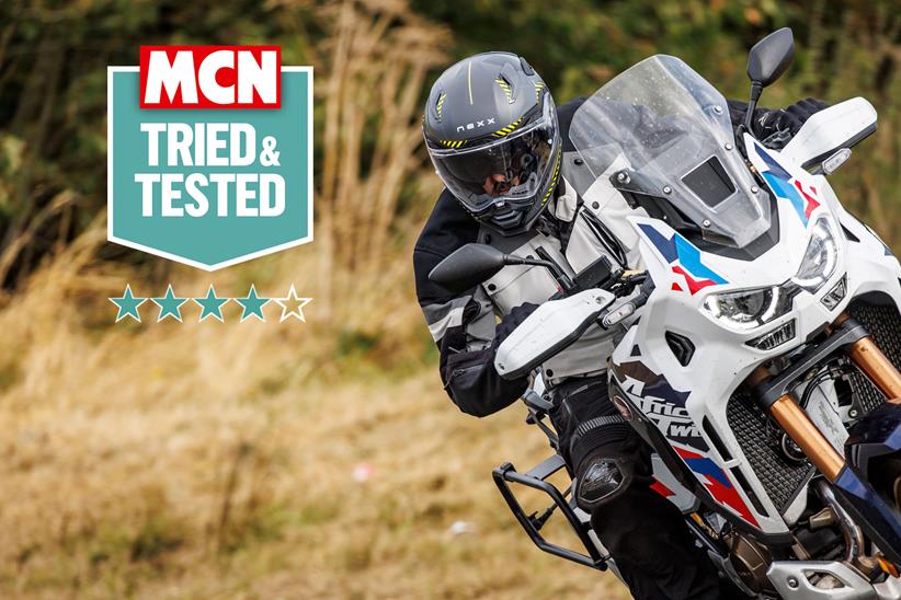 Rider wearing a Nexx X.WST3 helmet on an Africa Twin motorcycle