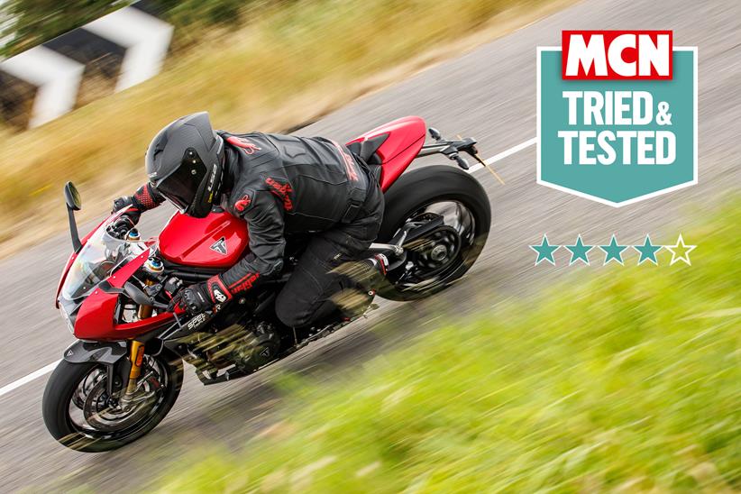 LS2 Carbon GP helmet worn on a red Triumph Speed Triple 1200RR