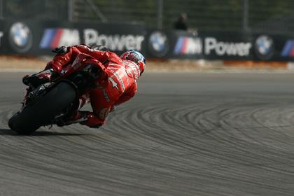 Casey Stoner heads into today's race with the fastest time in morning warm-up