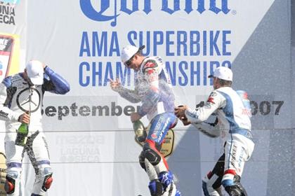 Ben Spies (centre) celebrates at Laguna Seca with teammate Mat Mladin (right)