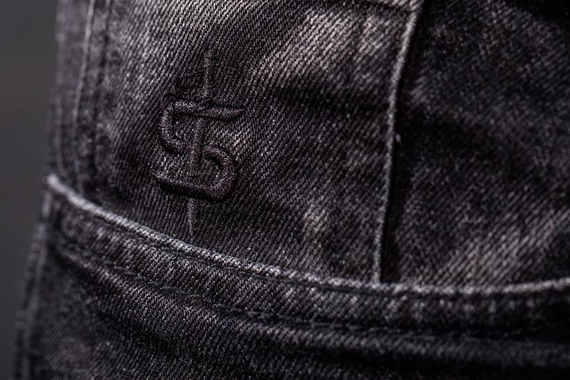 Close up of the Spada logo on the coin pocket on the Spada Drifter jeans