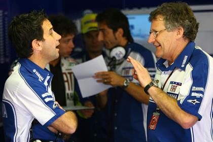 Davide Brivio speaking to Valentino Rossi's crew chief Jerry Burgess in Estoril