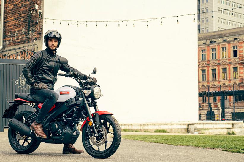 A rider sits on a Yamaha XSR125