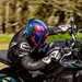 Rider cornering wearing a Shark Aeron