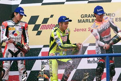 Valentino Rossi on the podium with his hero Norick Abe in 2001